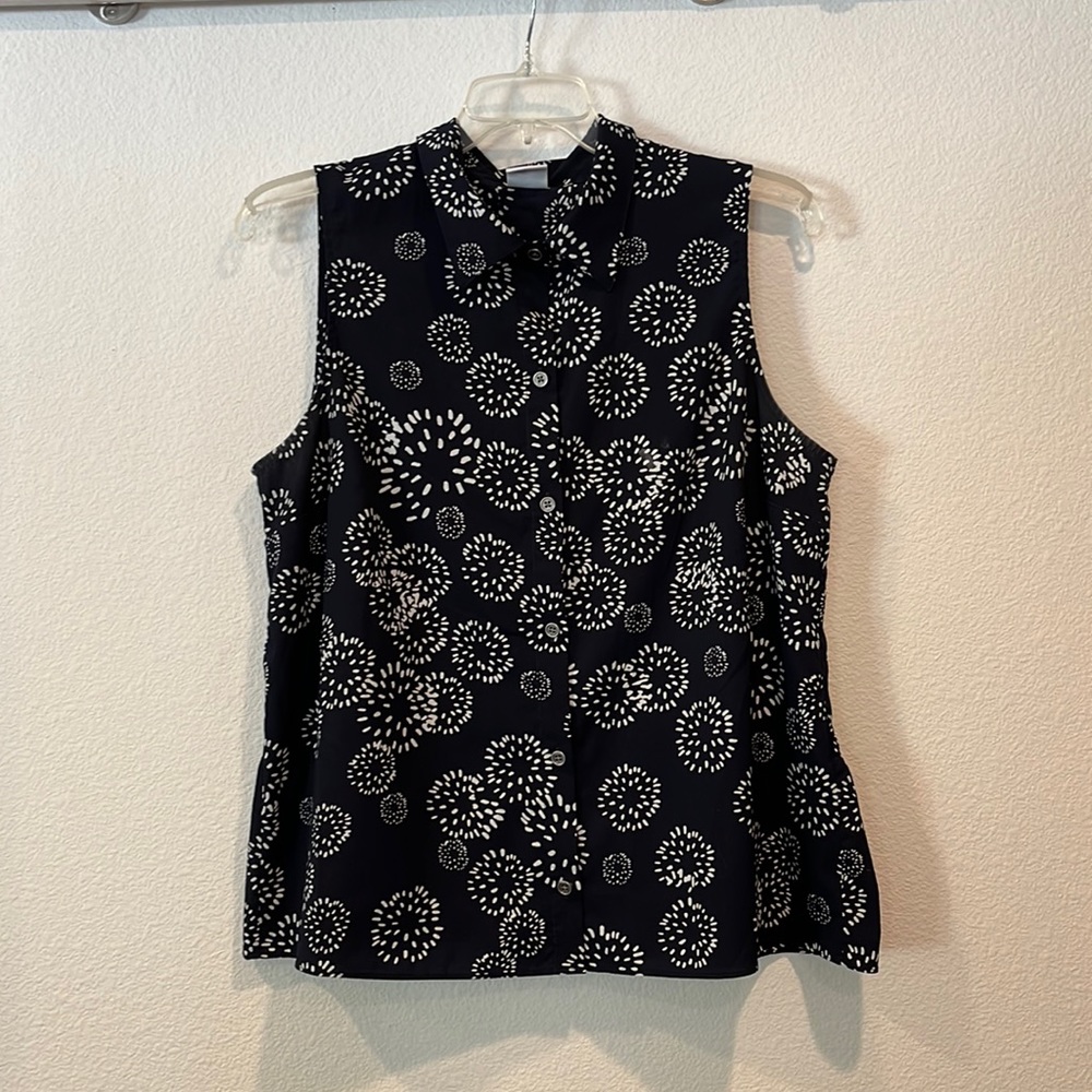 Dark Navy Cabi sleeveless blouse. Peplum trim in back.